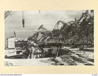 PORT MORESBY, NEW GUINEA. 1944-05-24. THE CRADLE PIECE AND UPPER MOUNTING OF NO. 2 GUN AT BASILISK BATTERY, 801ST ANTI-AIRCRAFT AND COAST ARTILLERY BATTERY AT HEADQUARTERS MORESBY BASE SUB AREA. ..