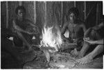 Men roasting breadfruit