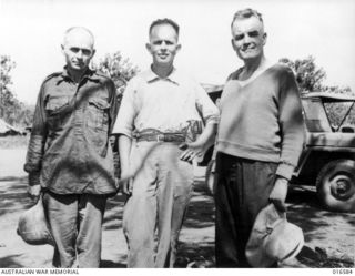 Port Moresby, New Guinea. 1943-08-31. Two missionaries, Father K. Laumann (Germany), Father A. Cruysberg (Holland) and Brother A. Wiedmann (Germany) after their arrival in Port Moresby. Together ..