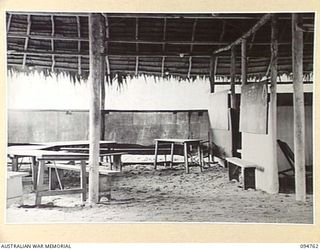 LAE AREA, NEW GUINEA, 1945-08-10. THE INTERIOR OF THE BUSU EDUCATION CENTRE HUT UNDER THE COMMAND OF THE DEPUTY ASSISTANT DIRECTOR OF EDUCATION, LAE BASE SUB-AREA