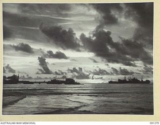 BOUGAINVILLE. 1945-04-23. SUNSET ACROSS TOROKINA HARBOUR SHOWING PURUATA ISLAND