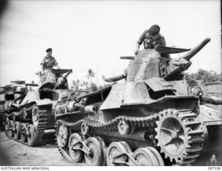 RAPOPO AIRSTRIP, NEW BRITAIN. 1945-09-28. AUSTRALIAN CREW COMMANDERS OF 2/4 ARMOURED REGIMENT IN THE TURRETS OF JAPANESE TYPE 95 HA-GO LIGHT TANKS WHICH HAVE BEEN HANDED OVER AT THE AIRSTRIP. A ..