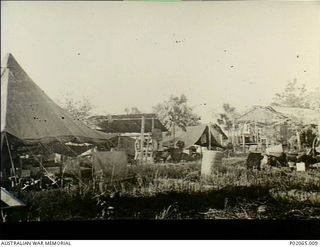 Alexishafen, New Guinea. 1944. Tents set up at the camp of 17 Field Hygiene Company. This company, with the help of indigenous (native) Papuans, worked to eradicate the malarial mosquito. Note the ..