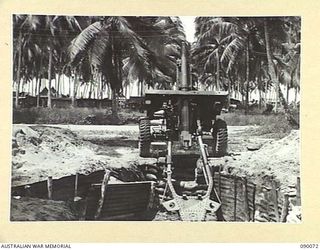 AITAPE, NEW GUINEA. 1945-03-10. ARTILLERY IN JUNGLE CONDITIONS. A NEW HIGH ANGLE 25-POUNDER POSITION INSTALLED IN THE 6 DIVISION AREA BY 2/3 FIELD REGIMENT, ROYAL AUSTRALIAN ARMY PERSONNEL