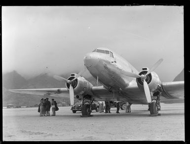 View of a C47 Dakota transport plane with unidentified USAAF personnel, Tafuna Airfield, American Samoa