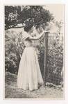 Evelyn Murray's secretary in the garden at Government House, Port Moresby, c1949