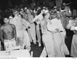 PORT MORESBY, PAPUA, 1944-02-25. A DANCE AT THE OFFICERS' CLUB. THE CLUB IS PATRONIZED BY AUSTRALIAN AND AMERICAN OFFICERS AND NURSES