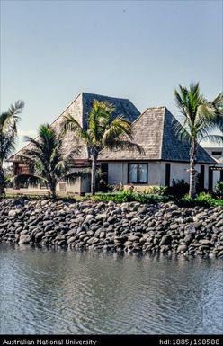 Fiji - waterside houses with sloped tiled roofs