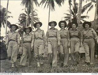 MADANG, NEW GUINEA. C. 1945. GROUP PORTRAIT OF NURSES, LEFT TO RIGHT: SISTERS WITCOMBE, MCNAMARA, FUREY, SENIOR SISTER DOHERTY, SISTERS SCHOLES, RODDA, FEWKES, IN THEIR TROPICAL UNIFORMS AT NO. 1 ..