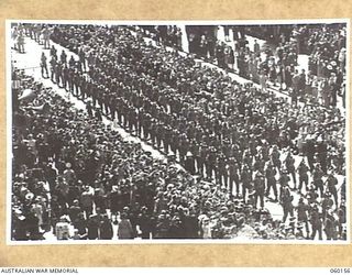 MELBOURNE, AUS. 1943-11-18. TROOPS OF HEADQUARTERS, 17TH AUSTRALIAN INFANTRY BRIGADE MARCHING ALONG FLINDERS STREET DURING THE BRIGADE'S TRIUMPHANT MARCH THROUGH THE CITY, UPON ITS RETURN TO THE ..