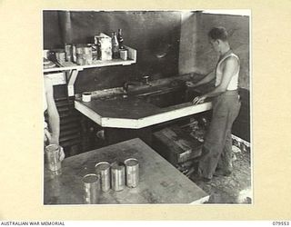 ORO BAY, NEW GUINEA. 1943-07. THE GALVANISED IRON WASHING UP SINK IN A CORNER OF THE KITCHEN OF THE 10TH FIELD AMBULANCE