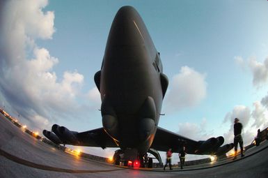 Fisheye lens view showing US Air Force (USAF) Airmen assigned to the 5th Bomb Wing (BW), preparing to launch at USAF B-52 Stratofortress aircraft, on the flight line at Andersen Air Force Base (AFB), Guam