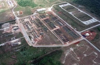 Aerial view showing the tent city living facilities for deployed US Military personnel at Anderson AFB, Guam during Exercise TANDEM TRHUST 99