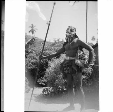 Masked dancer holding a spear, Sepik River, New Guinea, 1935 / Sarah Chinnery