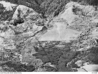 1943-03-03. PAPUA. JAPANESE UNSUCCESSFULLY ATTACK WAU. AERIAL VIEW OF WAU AERODROME DURING THE JAPANESE ATTACK