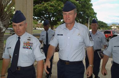 US Air Force (USAF) CHIEF MASTER Sergeant of the Air Force (CMSAF) Gerald R. Murray (center), walks with CHIEF MASTER Sergeant (CMSGT) Timothy E. Driscoll to an enlisted personnel briefing at the Memorial Theater at Hickam Air Force Base (AFB), Hawaii (HI)
