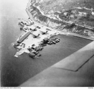 Port Moresby, New Guinea. 1944-01-11. An aerial view of the Royal Australian Air Force Marine Section with three Catalina aircraft parked on the hardstanding