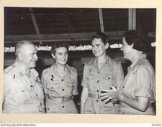 LAE, NEW GUINEA. 1945-05-11. GENERAL SIR THOMAS A. BLAMEY, COMMANDER-IN-CHIEF, ALLIED LAND FORCES, SOUTH WEST PACIFIC AREA (1), WITH LIEUTENANT E.J. WETKIN (2), LIEUTENANT J.D. LOVE (3), AND ..