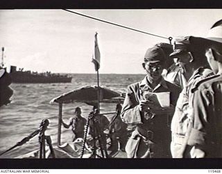 OFF KAHILI POINT, BOUGAINVILLE. 1945-09-07. A JAPANESE SURRENDER ENVOY READING A MESSAGE FROM HIS COMMANDER, LIEUTENANT-GENERAL (LT-GEN) M. KANDA, COMMANDER, 17TH JAPANESE ARMY, TO COMMANDER A. E. ..