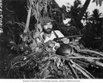 Dr. J. P. E. Morrison hunting a gooney bird, Bikini Atoll, summer 1947