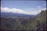 Western Highlands: river and road in a broad mountain valley