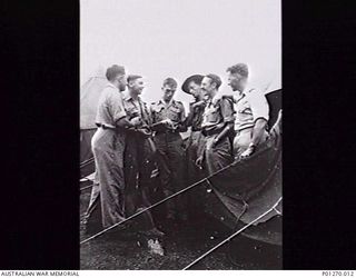 PORT MORESBY, 1944-04. SIX FORMER EMPIRE AIR TRAINING SCHEME TRAINEES WHO HAVE RETURNED TO AUSTRALIAN AFTER COMPLETING THEIR OPERATIONAL TOURS IN ENGLAND ATTACHED TO 530 SQUADRON UNITED STATES ARMY ..