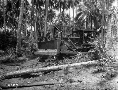 2nd NZEF IP bulldozer clearing a track through vegetation, on Nissan Island, Papua New Guinea