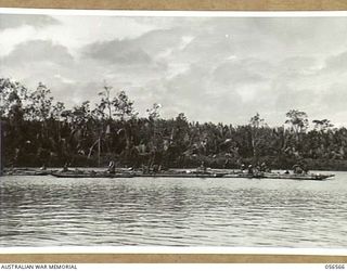 MIRAVASI, NEW GUINEA, 1943-09-07. NATIVES FISHING IN CANOES OFF MIRAVASI VILLAGE
