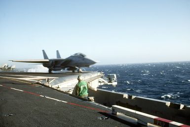 A Fighter Squadron 213 (VF-213) F-14A Tomcat aircraft is launched from the nuclear-powered aircraft carrier USS Abraham Lincoln (CVN-72) during flight operations near Hawaii