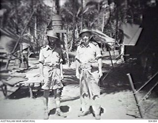 ORO BAY, NEW GUINEA. 1943. NAVY OFFICE STAFF. COMMANDER WEBB RAN, THE NAVAL OFFICER-IN-CHARGE AND PAY LIEUTENANT CONNOR, THE INTELLIGENCE OFFICER. (NAVAL HISTORICAL COLLECTION)