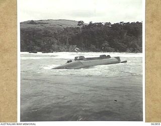 GNEISNEAU POINT, NEW GUINEA. 1944. A WRECKED JAPANESE SUBMARINE IN KELANOA HARBOUR