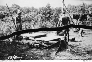 SEPIK RIVER AREA, NEW GUINEA. 1943-08-13. LIEUTENANT GUY BLACK (LEFT) AND LIEUTENANT HARRY AIKEN, `LOCUST' PARTY, M SPECIAL UNIT, SERVICES RECONNAISSANCE DEPARTMENT, ALLIED INTELLIGENCE BUREAU, ..