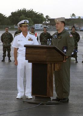 US Navy (USN) Admiral (ADM) Thomas Fargo, Commander, Pacific Fleet, looks on as USN Lieutenant (LT) Shane Osborn, Commander of the USN EP-3 "Aries II" aircraft, involved in the March 31st accident with a Chinese F-8 aircraft, addresses the crowd at Hickam AFB, Hawaii (HI). The aircrafts crewmembers arrived at Hickam AFB, HI from Andersen AFB Guam, as a part of Operation VALIANT RETURN. The EP-3 crewmembers were detained in China for 17-days prior to being released