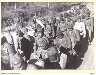 BOUGAINVILLE, 1945-09-23. A PARTY OF BADLY CLAD, ILL FED JAPANESE WHO WERE THE PACE MAKERS FOR A 10 MILE MARCH FROM THE BUKA AREA TO A CONCENTRATION CAMP. THEY WERE ESCORTED BY TROOPS OF 27 ..