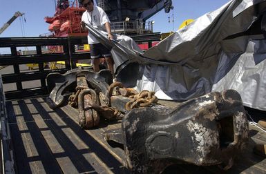 One of the anchors retrieved from the Japanese fishing vessel Ehime Maru is loaded onto a truck on the pier at Pearl Harbor, Hawaii (HI)