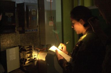 US Air Force (USAF) Technical Sergeant (TSGT) Gillian Bernabe, 154th Communications Flight, Hawaii (HI) Air National Guard (ANG) performs a periodic maintenance inspection on the fiber optic cable at the 150th Aircraft Control and Warning Squadron, located on the island of Kauai, HI