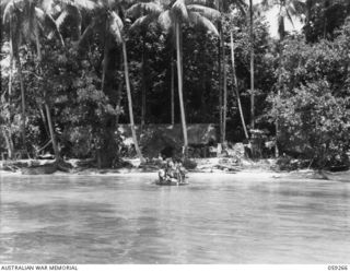TAMI, NEW GUINEA, 1943-10-24. BOAT LOAD OF NATIVES GOING ASHORE AT TAMI ISLAND