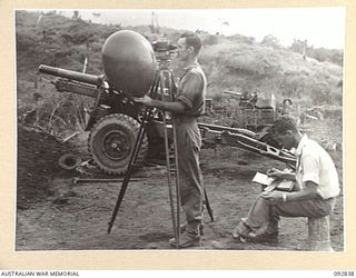 WEWAK AREA, NEW GUINEA, 1945-06-05. WO C.J. PADDICK, 3 MOBILE METEOROLOGICAL FLIGHT, RAAF, ATTACHED HQ ROYAL AUSTRALIAN ARTILLERY 6 DIVISION, COMPUTING BALLISTIC WIND FOR ARTILLERY CO-OPERATION. ..