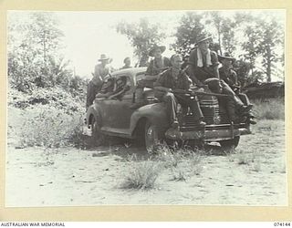 HANSA BAY, NEW GUINEA. 1944-06-20. TROOPS OF THE 4TH INFANTRY BATTALION DRIVING A CAPTURED JAPANESE STAFF CAR AS THEY MAKE THEIR WAY TO THE FRONT LINE