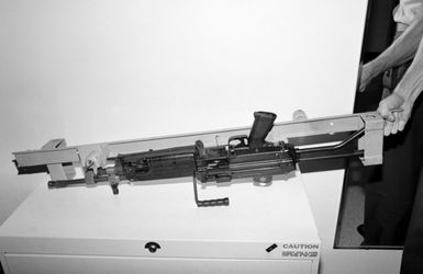 A locking storage rack aboard the amphibious assault ship USS SAIPAN (LHA 2) that has been modified to accept the M249 squad automatic weapon (SAW) (shown in rack) and the M16A2 rifle