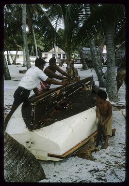 Tio Marsters and John James Marsters working on the keel of cutter 'Melbourne', on Palmerston Island