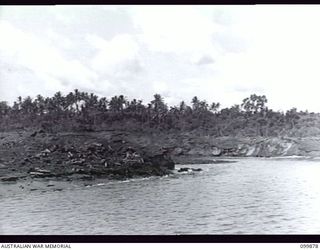 RABAUL, NEW BRITAIN, 1946-03-01. AFTER A LONG PERIOD OF HEAT, SELF COMBUSTION OF CORDITE CAUSED A FIRE IN 5,500 TONS OF JAPANESE AMMUNITION WAS DESTROYED IN THE FIRE WHICH RAGED FOR SEVERAL HOURS. ..