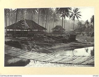 MILNE BAY, NEW GUINEA 1944-02-10. THE RECENTLY COMPLETED RECREATIONAL HUT USED BY AUSTRALIAN NEW GUINEA ADMINISTRATIVE UNIT PERSONNEL AT THE HEADQUARTERS BARAGA NATIVE LABOUR CAMP