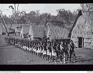 BISIATABU, SOGERI VALLEY, NEW GUINEA. 1943-07-01. "C" COMPANY, 1ST PAPUAN INFANTRY BATTALION DRILLING ON THEIR PARADE GROUND