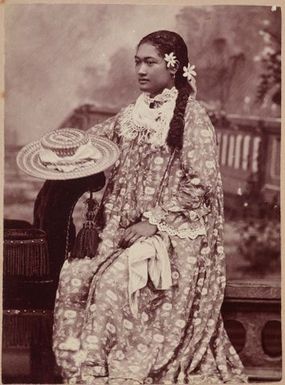 Studio portrait of young woman in flower dress. From the album: Tahiti, Samoa and New Zealand scenes