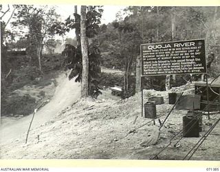 FINSCHHAFEN AREA, NEW GUINEA, 1944-03-20. ONE OF MANY BATTLE SIGNS IN THE FINSCHHAFEN AREA, THIS SIGN RECORDS THE ACTIVITIES OF THE 2/13TH BATTALION, THE 2/15TH INFANTRY BATTALION AND MOVEMENTS OF ..