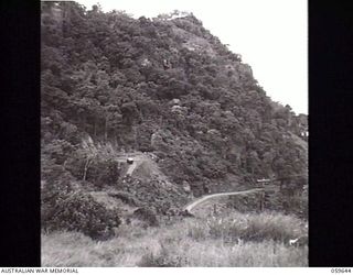 DONADABU, NEW GUINEA. 1943-11-07. VIEW OF THE ROUNA FALLS ROAD WINDING UP THE MOUNTAINSIDE