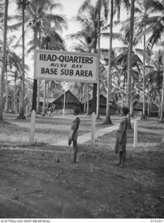 MILNE BAY, NEW GUINEA, 1944-02-10. THE ENTRANCE TO THE HEADQUARTERS MILNE BAY BASE SUB AREA. THIS SITE WAS USED AS THE HEADQUARTERS OF THE 11TH AUSTRALIAN DIVISION, THE 5TH AUSTRALIAN DIVISION AND ..