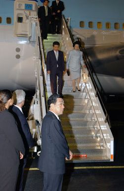 President Roh Moo-Hyun, President of the Republic of Korea, and his wife Kwon Yang-Sook, descend the stairs of a Korean Airlines 747 aircraft during their arrival at Hickam Air Force Base, Hawaii, on Nov. 21, 2004. President Roh is stopping over in Hawaii after participating in the Asia Pacific Economic Corporation summit in Chile. (PHOTO by Mark Bates, CIV) (Released)