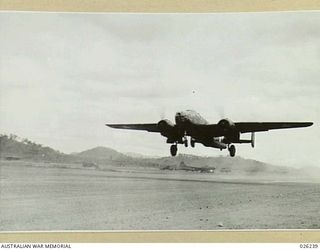 New Guinea, 1942-08-10. A North American B25 Mitchell bomber aircraft takes off from a New Guinea airfield for a raid over Japanese occupied territory